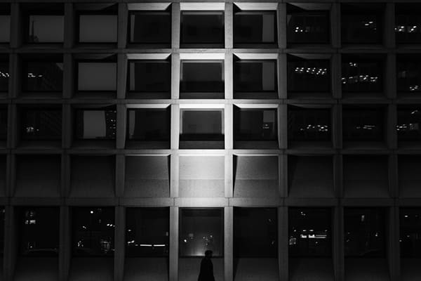 A building facade with contrasting light and shadow